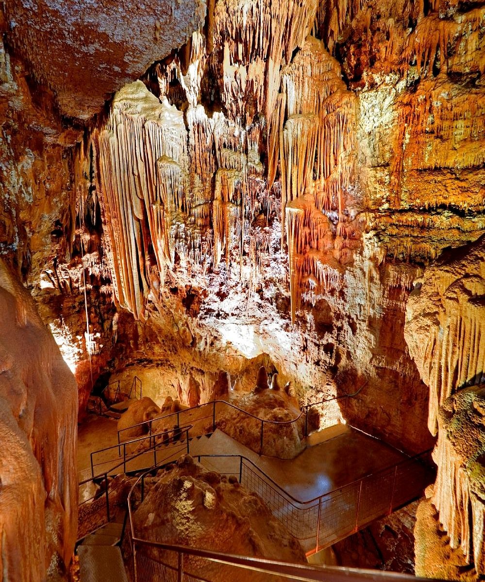 A lit chamber of stalactites and stalagmites in an Istrian show cave